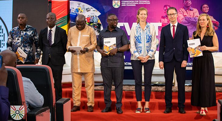 Representatives of German-Ghanaian bilateral cooperation in TVET are presenting the new Ghanaian TVET report on stage of the first TVET Symposium Ghana