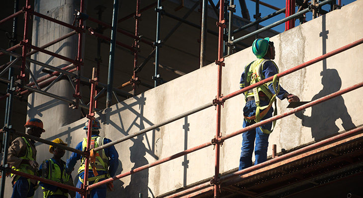 Construction workers on scaffolding