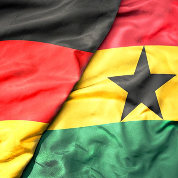 The flags of Germany and Ghana are spread out next to each other.